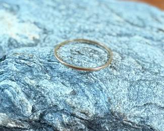 This lot features a vintage 10k gold band in a size 8.5 with a total approx. weight of .50 grams.
