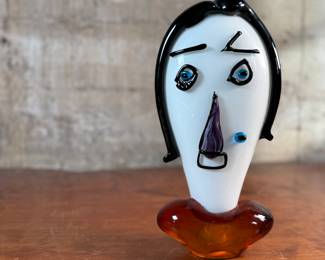 This lot features an Italian Murano glass face sculpture, circa 1970s. This sculpture is in good overall condition and measures, 14” H x 7” W x 3.5” D.

