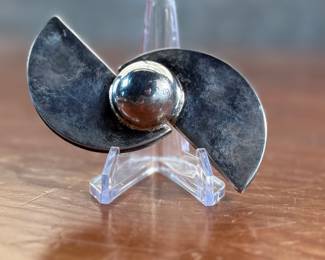 This lot features a stunning mid-century sterling silver brooch pin, unsigned, and possibly Danish or Scandinavian with a total approx. weight of 41.00 grams.
