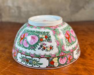 This lot features an antique Chinese rose medallion bowl in excellent condition that measures, 5.5” H x 12” W x 12” D. Marked underneath, "Overjoy" which is generally associated with porcelain that was hand-painted in Hong Kong.
