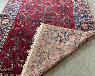 This lot features an antique handwoven Sarouk rug that measures, 78” x 62”.
