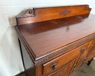 This lot features an antique Quarter-Sawn Oak sideboard with two dove tailed drawers and two cabinets with shelving. Minor wear throughout, but in good overall condition and measures, 42.5” H x 47.5” W x 17.25” D.
