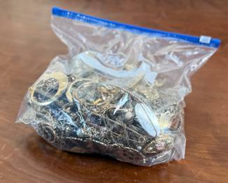 This lot features a large bag full of costume jewelry and weighs just under 4lbs.
