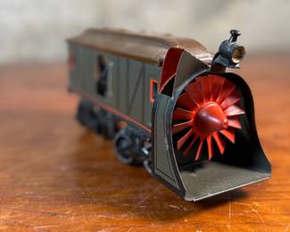 This lot features a collection of three (3) vintage toy train cars, most likely manufactured by Ives Railway Lines. One is marked, “Germany” underneath as shown in photos. All of them appear to be O gauge models.

