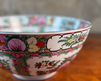 This lot features an antique Chinese rose medallion bowl in excellent condition that measures, 5.5” H x 12” W x 12” D. Marked underneath, "Overjoy" which is generally associated with porcelain that was hand-painted in Hong Kong.
