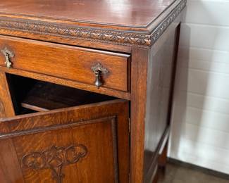 This lot features an antique Quarter-Sawn Oak sideboard with two dove tailed drawers and two cabinets with shelving. Minor wear throughout, but in good overall condition and measures, 42.5” H x 47.5” W x 17.25” D.
