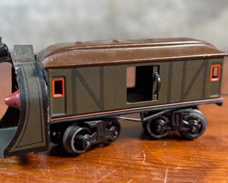This lot features a collection of three (3) vintage toy train cars, most likely manufactured by Ives Railway Lines. One is marked, “Germany” underneath as shown in photos. All of them appear to be O gauge models.
