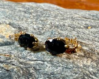This lot features a pair of stunning 14k gold earrings, each with sapphire & a diamond. This pair has a total approx. weight of .72 grams.
