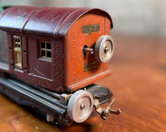 This lot features a collection of five (5) pre-war model train cars, manufactured by Lionel and all most likely O gauge. Includes a locomotive, a box car, a few cabooses, and more.
