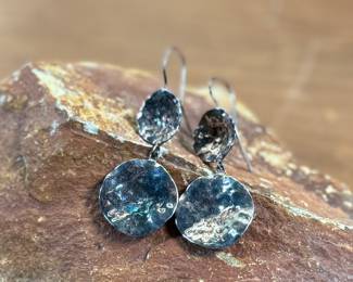 This lot features a pair of sterling silver earrings, manufactured and signed by ZINA with a total approx. weight of 10.94 grams.
