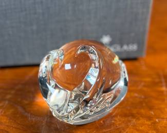 "Octopus Hand Cooler", a Steuben glass octopus sculpture with a box to accompany this cutie!The Steuben Glass Works company, founded by Frederick Carder in 1903, was a prominent American glass company. The octopus sculpture was designed by Taf Lebel Schaefer and was introduced in 2005.
