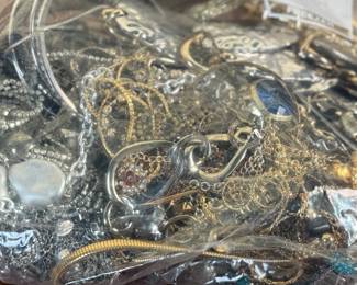 This lot features a large bag full of costume jewelry and weighs just under 4lbs.
