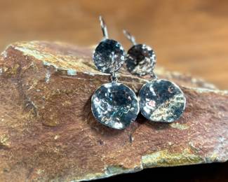 This lot features a pair of sterling silver earrings, manufactured and signed by ZINA with a total approx. weight of 10.94 grams.

