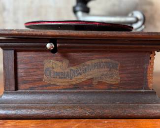 This lot features an antique Columbia Gramaphone with a large horn included. Gramophones were mechanical devices used for the reproduction of sound. The term "gramophone" was coined by its inventor, Emile Berliner, in the late 1880s. Comes untested.
