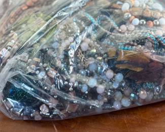 This lot features a large bag full of costume jewelry and weighs just under 4lbs.
