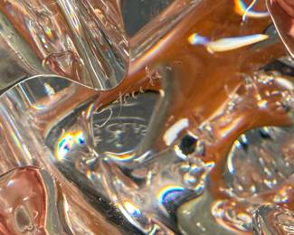 This lot features a Steuben crystal elephant with a raised trunk, designed by James Houston in 1964. Comes with a Steuben box for storage.
