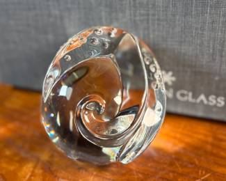 "Octopus Hand Cooler", a Steuben glass octopus sculpture with a box to accompany this cutie!The Steuben Glass Works company, founded by Frederick Carder in 1903, was a prominent American glass company. The octopus sculpture was designed by Taf Lebel Schaefer and was introduced in 2005.
