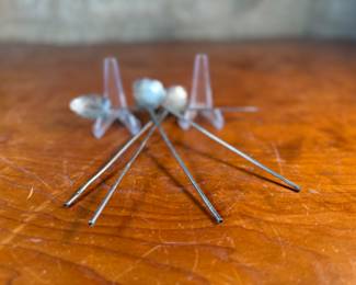 This lot features a collection of five (5) antique sterling silver tea or matcha straws with a total approx. weight of 28.57 grams.
