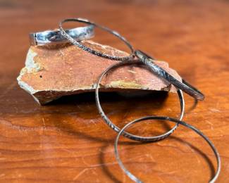 This lot features a collection of five (5) sterling silver bracelets with a total approx. weight of 70.97 grams.
