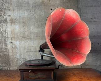 This lot features an antique Columbia Gramaphone with a large horn included. Gramophones were mechanical devices used for the reproduction of sound. The term "gramophone" was coined by its inventor, Emile Berliner, in the late 1880s. Comes untested.
