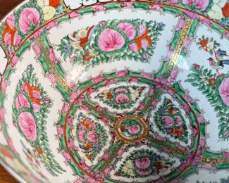 This lot features an antique Chinese rose medallion bowl in excellent condition that measures, 5.5” H x 12” W x 12” D. Marked underneath, "Overjoy" which is generally associated with porcelain that was hand-painted in Hong Kong.
