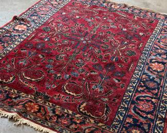This lot features an antique handwoven Sarouk rug that measures, 78” x 62”.

