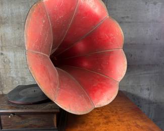 This lot features an antique Columbia Gramaphone with a large horn included. Gramophones were mechanical devices used for the reproduction of sound. The term "gramophone" was coined by its inventor, Emile Berliner, in the late 1880s. Comes untested.
