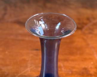 This lot features a vase from the Danish glassworks company, Holmegaard. The company was founded in 1825 and is known for its high-quality glassware. This vase is in very good condition, no chips.
