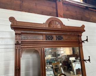 A stunning antique hall tree with solid brass hardware, a single dove tailed drawer below the bench, and an umbrella holder. This piece is in very good condition for its age and measures, 85” H x 36” W x 21” D.
