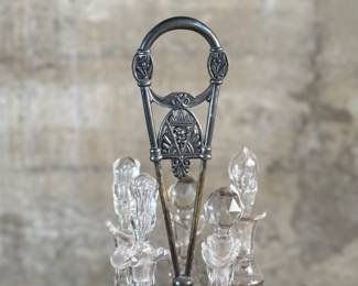 This lot features an antique cruet that appears to be made in the 19th century with five (5) misc. bottles, all of which appear to be cut crystal glass. This cruet measures, 18” H x 8” W x 8” D.
