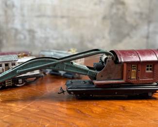 This lot features a collection of five (5) pre-war model train cars, manufactured by Lionel and all most likely O gauge. Includes a locomotive, a box car, a few cabooses, and more.

