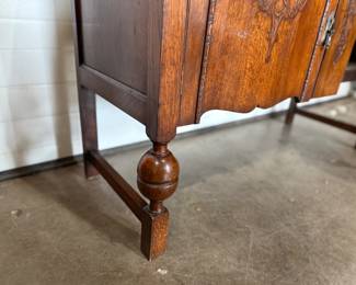 This lot features an antique Quarter-Sawn Oak sideboard with two dove tailed drawers and two cabinets with shelving. Minor wear throughout, but in good overall condition and measures, 42.5” H x 47.5” W x 17.25” D.
