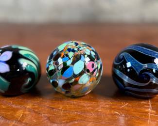 This lot features a collection of three (3) paperweights, all signed by Haberman Art Glass.

