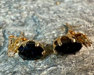 This lot features a pair of stunning 14k gold earrings, each with sapphire & a diamond. This pair has a total approx. weight of .72 grams.
