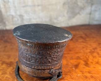 This lot features an antique etched copper cauldron, likely Turkish and from the 19th century. This piece measures, 9” H x 10” W x 10” D.
