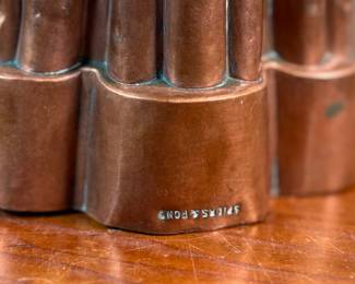 This lot features a Victorian copper pudding mold with maker mark present as shown in photos. Appears to read, "Spiers & Pond". Copper molds were popular during the Victorian era and were a sign of wealth and status. This mold measures, 4.5” H x 5” W x 5” D.
