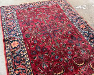 This lot features an antique handwoven Sarouk rug that measures, 78” x 62”.
