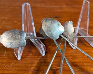 This lot features a collection of five (5) antique sterling silver tea or matcha straws with a total approx. weight of 28.57 grams.
