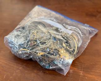 This lot features a large bag full of costume jewelry and weighs just under 4lbs.
