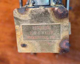This lot features a unique handcrafted locomotive sculpture made of various metals and salvaged materials. It has a brass plaque mounted on top from Jacksonville, Oregon. This sculpture measures, 6” H x 13” W x 5” D.
