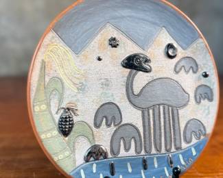 This lot features a piece of Seminario ceramics from Peru. The style, known as Seminario, was developed by Peruvian artists Pablo Seminario and his partner Marilú Behar. Based in the town of Urubamba in the Sacred Valley of the Incas, the artists’ work is inspired by the techniques and motifs of ancient Peruvian cultures, with a contemporary influence and unique artistic expression. Pablo Seminario’s work has been acquired by several museums, including the Smithsonian. This place measures, 7.75” across.
