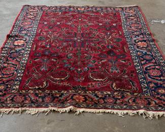 This lot features an antique handwoven Sarouk rug that measures, 78” x 62”.
