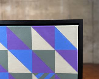 “Tranquility″, an original acrylic on canvas by listed artist, Camilo Requejo. Measures in frame, 13.25” H X 13.25” W. Requejo (1976-) is a Mexican-Spanish architect living in the US with more than 20 years of experience in design and construction, including several residential projects, sports, and medical facilities. Requejo started collecting art from recognized painters and sculptors for the past four years, waking up in him the desire of exploring and transporting his architectural style into art manifestation; combining geometric shapes with color combinations into the canvas.
