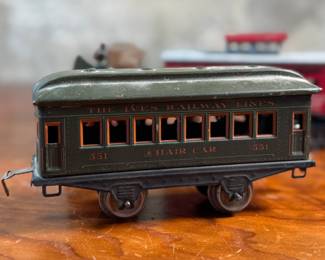 This lot features a collection of three (3) vintage toy train cars, most likely manufactured by Ives Railway Lines. One is marked, “Germany” underneath as shown in photos. All of them appear to be O gauge models.

