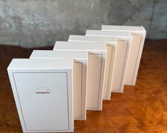 This lot features a collection of six (6) hardcover books with slipcases from the Library of America series. The Library of America is a nonprofit publisher that creates authoritative editions of classic American literature and historical documents. The books in the image include "Debate on the Constitution, " "Franklin: Writings, " "Jefferson: Writings, " "Washington: Writings, " and "Lincoln: Speeches and Writings".
