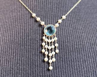 This lot features a stunning antique 14k gold necklace, possibly Edwardian with what appears to be Aquamarine and surrounded Pearls. This necklace measures 18” with a total approx. weight of 4.70 grams.
