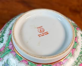 This lot features an antique Chinese rose medallion bowl in excellent condition that measures, 5.5” H x 12” W x 12” D. Marked underneath, "Overjoy" which is generally associated with porcelain that was hand-painted in Hong Kong.

