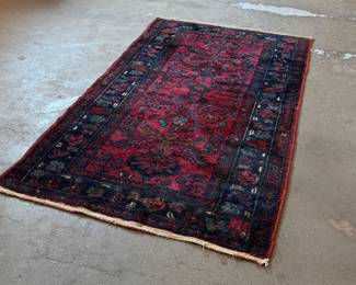 This lot features an antique Persian Hamadan rug that measures, 74” x 40”. Minor wear or “patina” throughout with a few small cuts/holes shown in photos.
