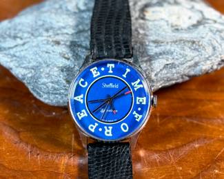 This lot features a 1970s Sheffield Temetrios watch that is Swiss made with a analog display in a 37mm case. In running condition, but may need to be serviced. “Time For Peace”.
