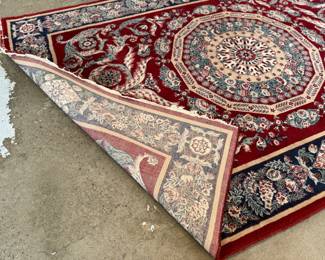This lot features a Persian style rug that measures, 94” H x 63” W. 
